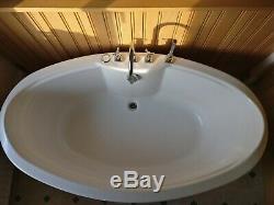 Air jet freestanding bathtub, red, Harris & Bailey taps and mixer, spa bath