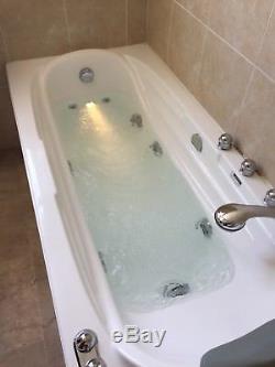 Jacuzzi bath with shower used